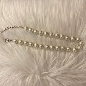 - Chunky faux pearl necklace